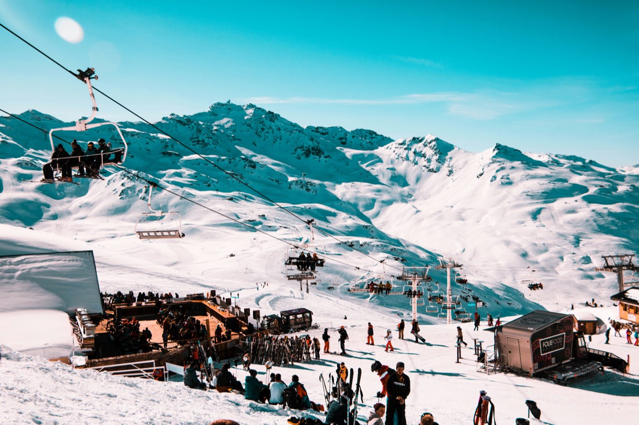 Alpine resort terrace beneath big peaks